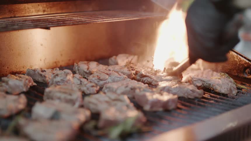 Meat is cooked on a grill
