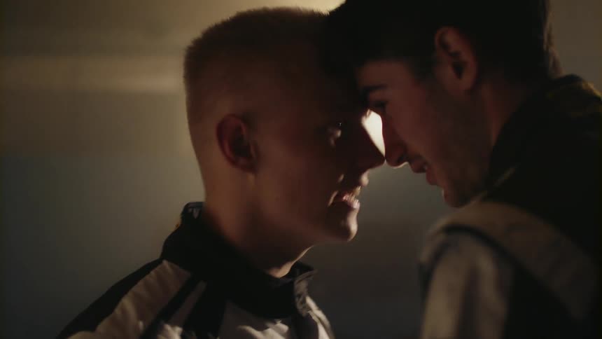 Two men argue standing face to face