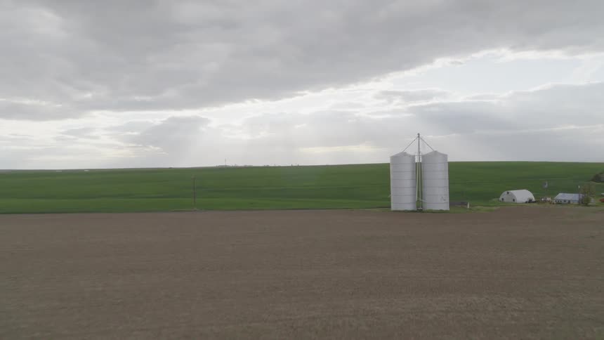 Revealing two silos next to fertile farmland