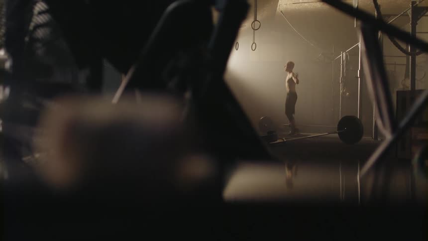 Man jumps rope in a gym