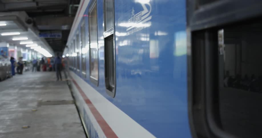 A subway train sits parked at a station
