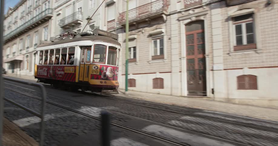Trolley cable car traveling up city street