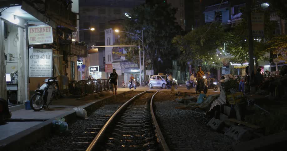 Cars and pedestrians commute in a city