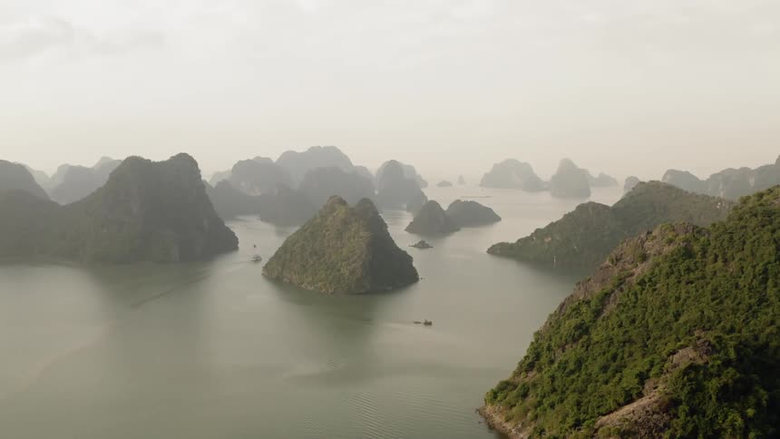 Large rock formations protrude from the waters