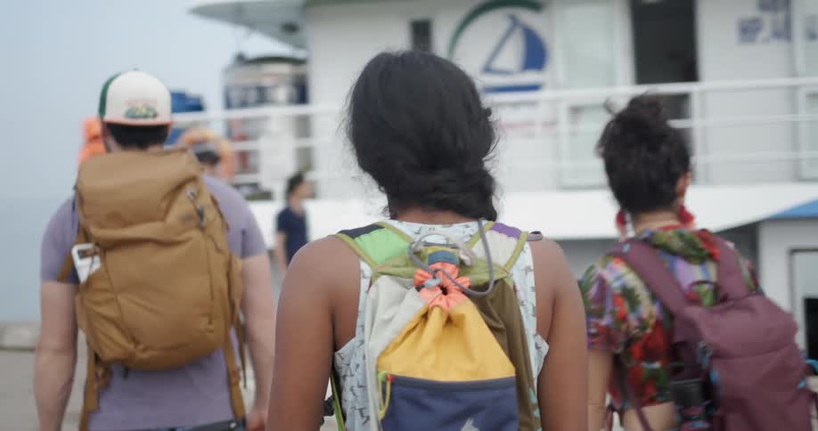 People walk towards the boat together
