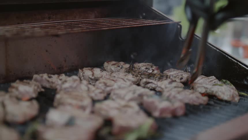 Meat is cooked on a grill