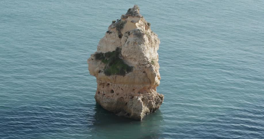 Large rock sticks up out of flowing water