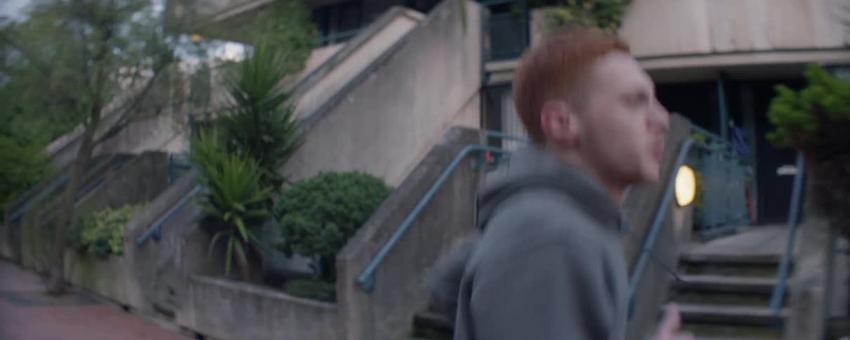 Man jogs in the city during the day
