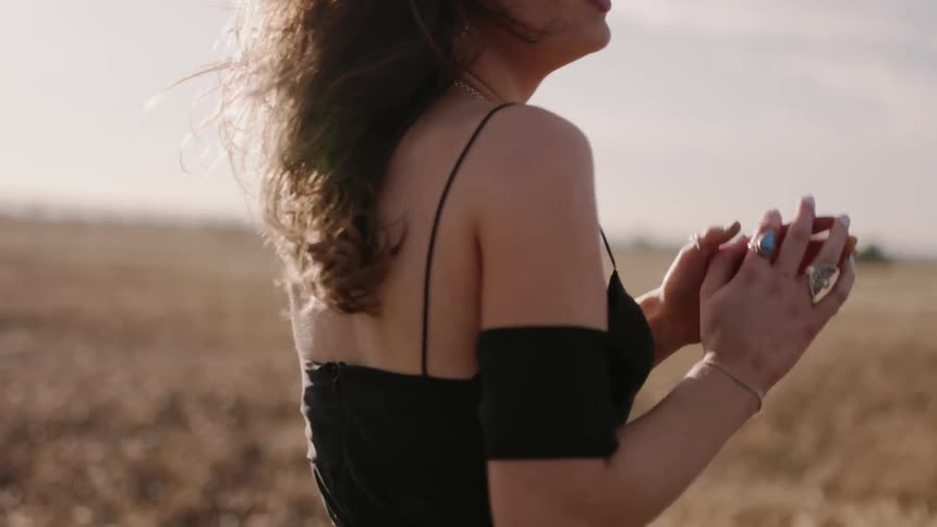 Woman walks in a rural field