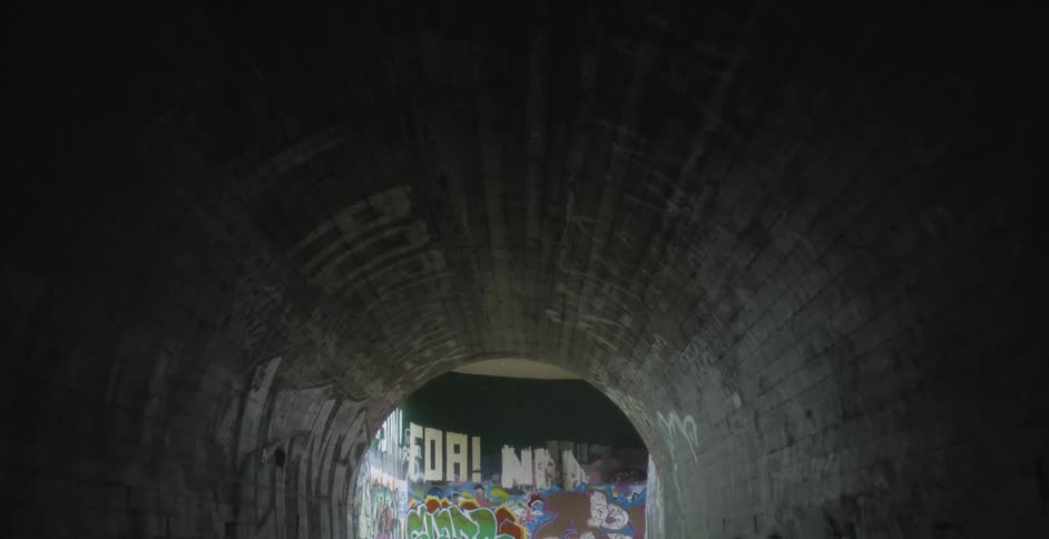 City tunnel with graffiti on the walls