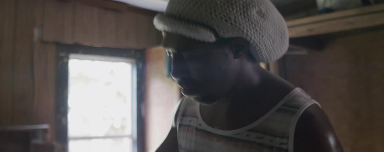 Man is playing an instrument inside his home