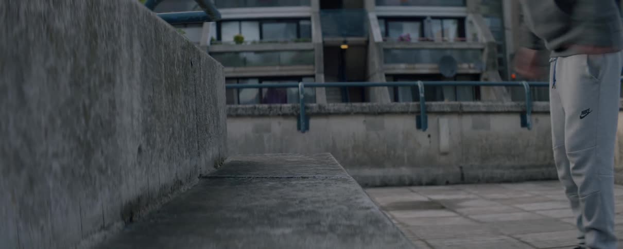 A man jumps up and down on the stone slab