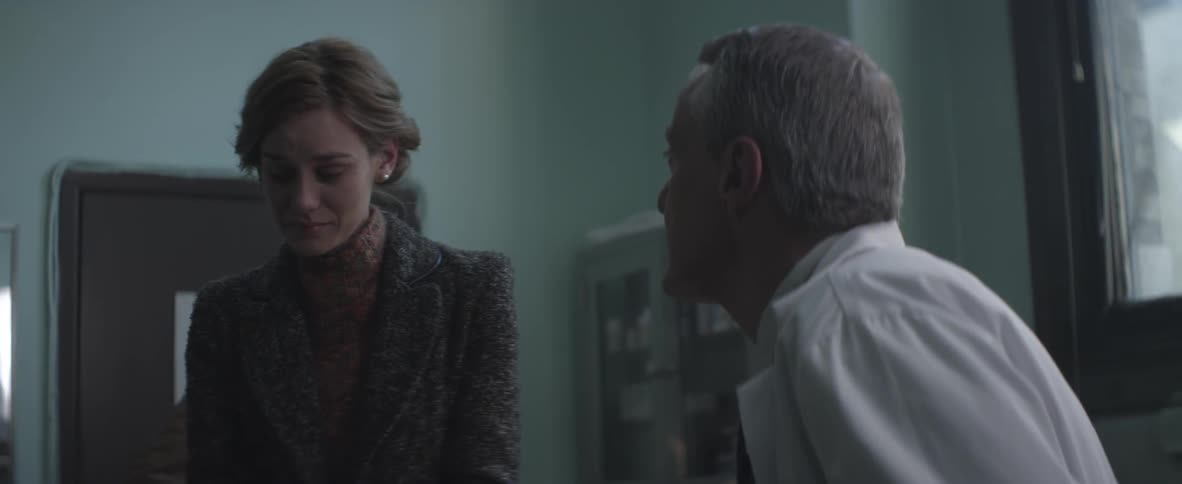 A woman and a doctor talking and the woman is sad