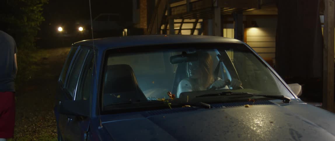Man climbs out of a parked car