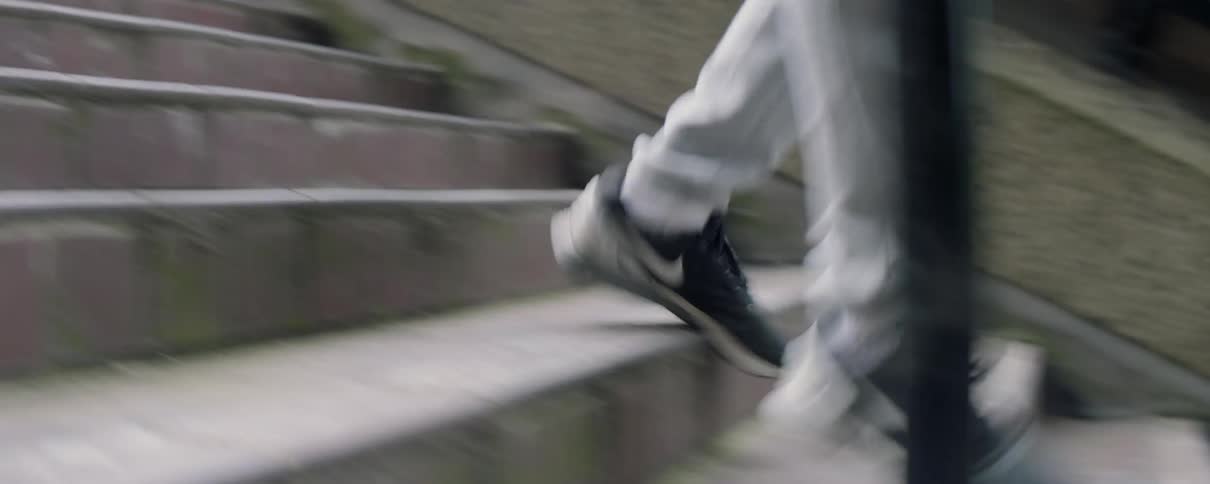 Man runs down city steps