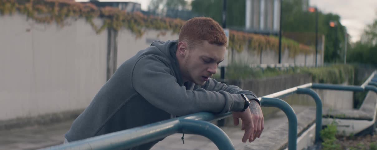 A redheaded man catches his breath