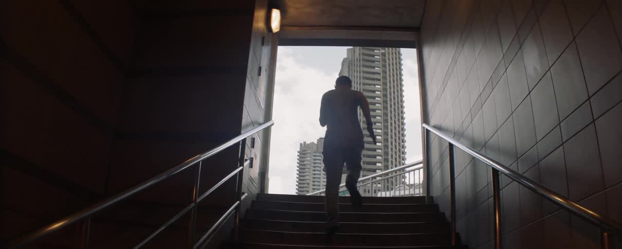 A man runs up the stairs