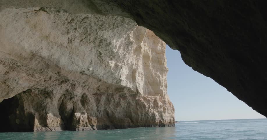 The cave leads to the ocean ahead