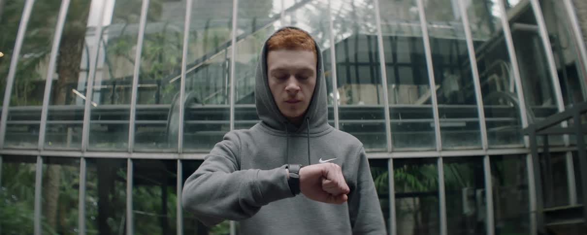 Man glances at his watch and looks defeated