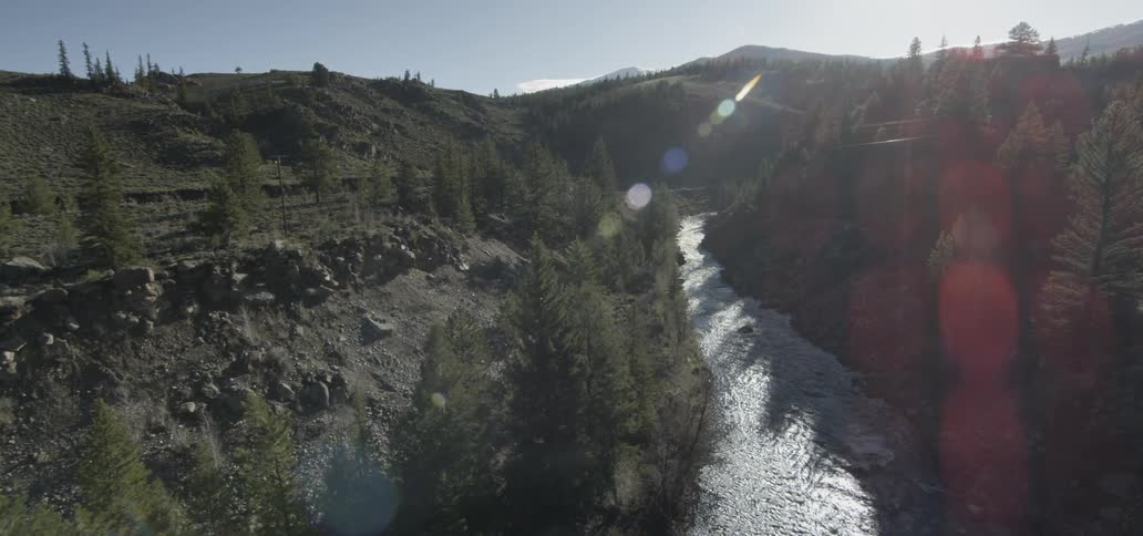 Sunlight shines on a mountain river