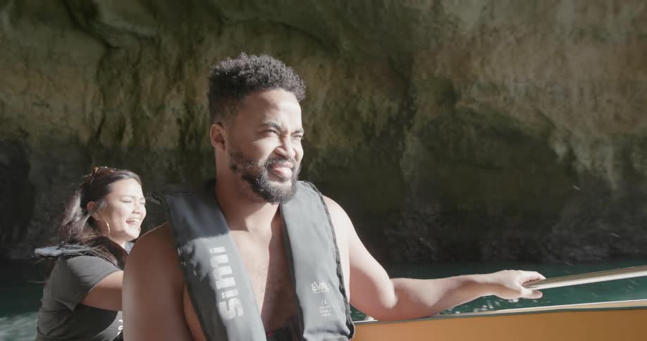 Man and woman ride in a boat