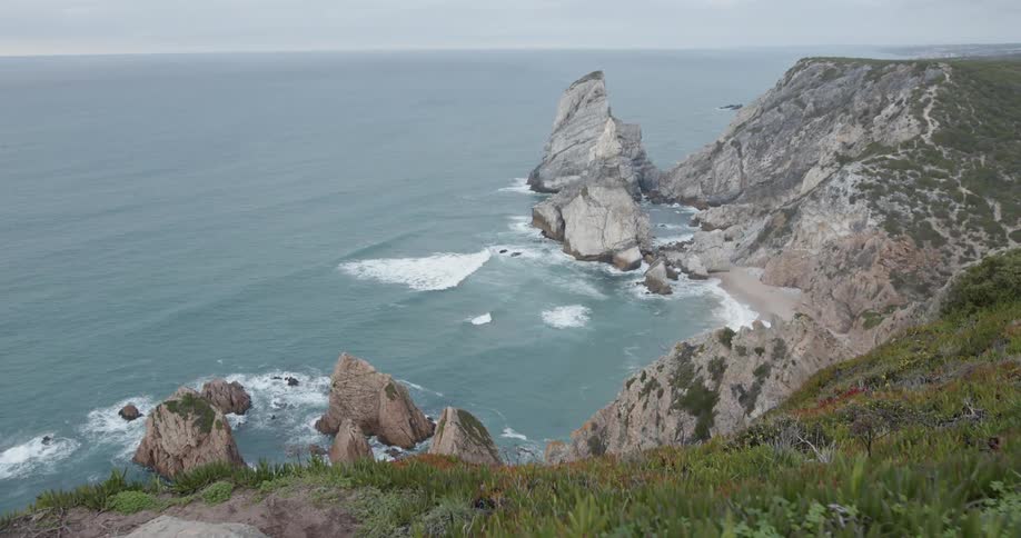 Ocean waves flow towards the rocky shore