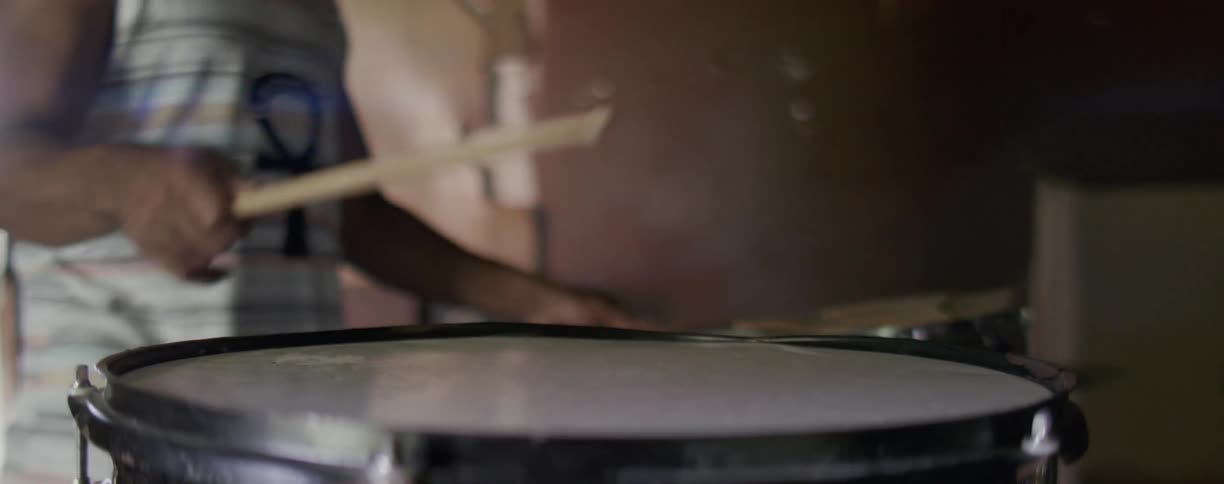 Man is playing the drums