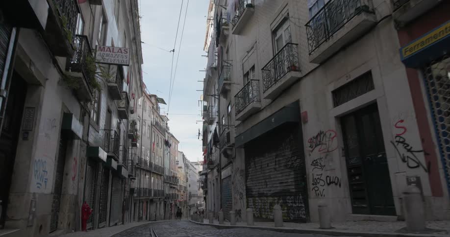 Old buildings rise up along narrow street