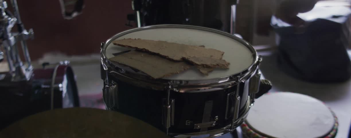 A drummer plays the drums