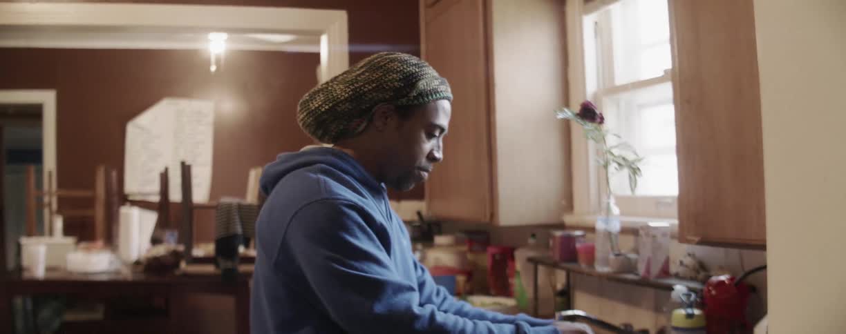 A man is preparing food in the kitchen