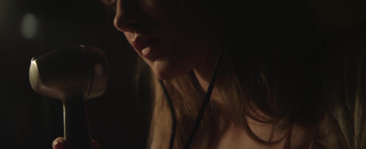 A woman speaking into a microphone
