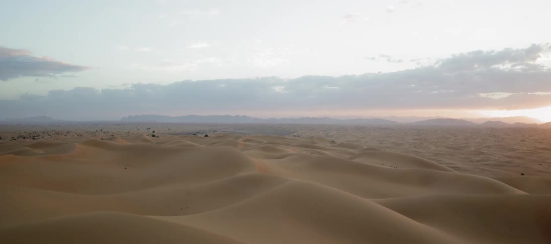 The sand dunes run into the distance