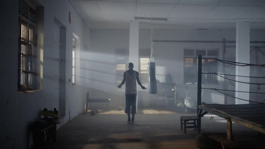 Man is jumping rope in a gym training room