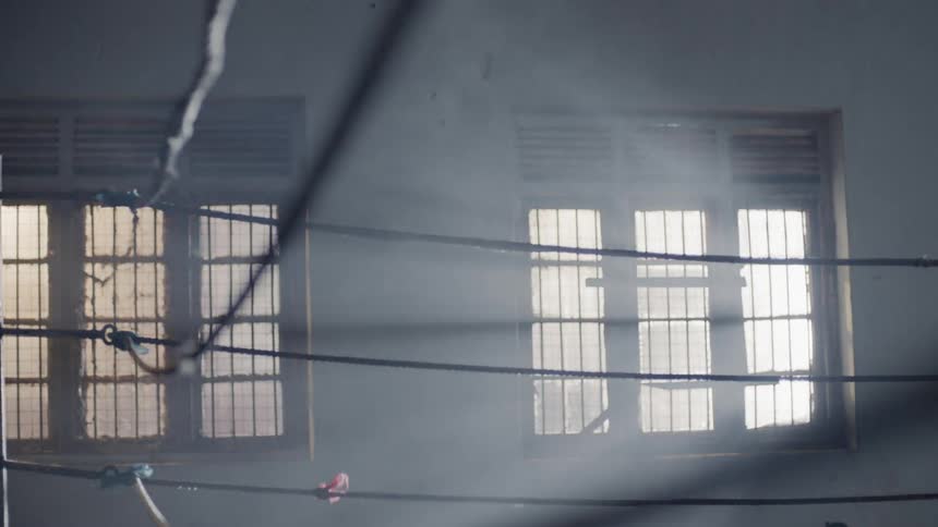 Lights shine on a boxing ring