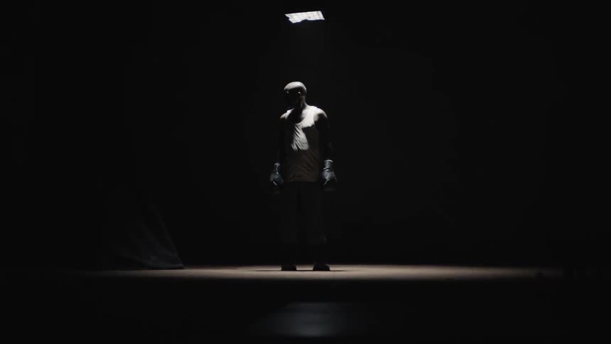 Man looks around a dark room