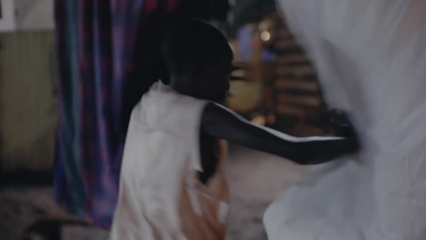 A boy is fleeing through a neighborhood at night