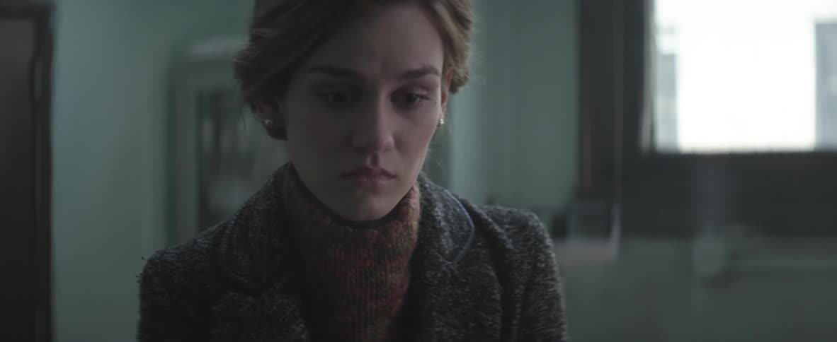 Woman gazes into the distance lost in thought