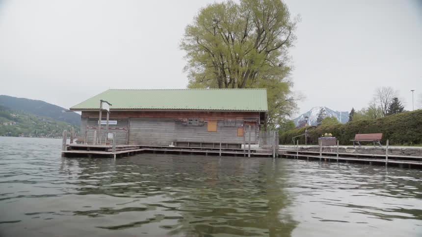 Water flows around a building on a lake