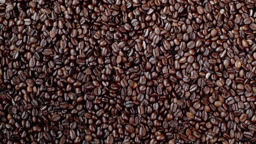 Coffee beans are sliding down a surface