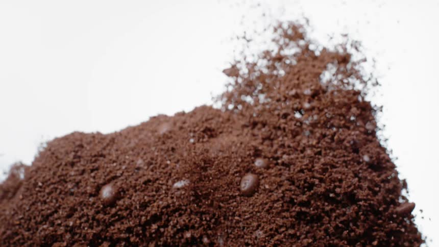 The coffee grounds explode all over