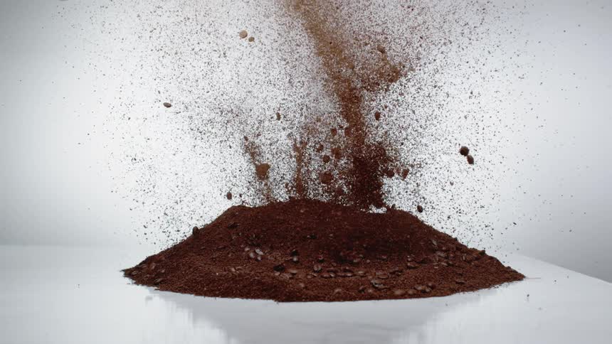 A pile of coffee explodes in the air