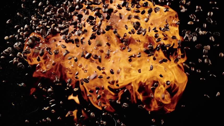 The coffee beans explode with fire into the air