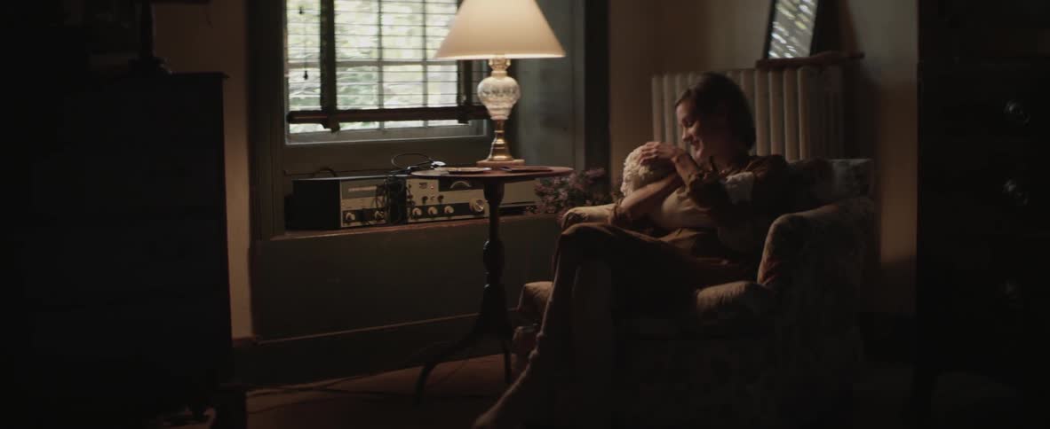 A person sitting with a baby