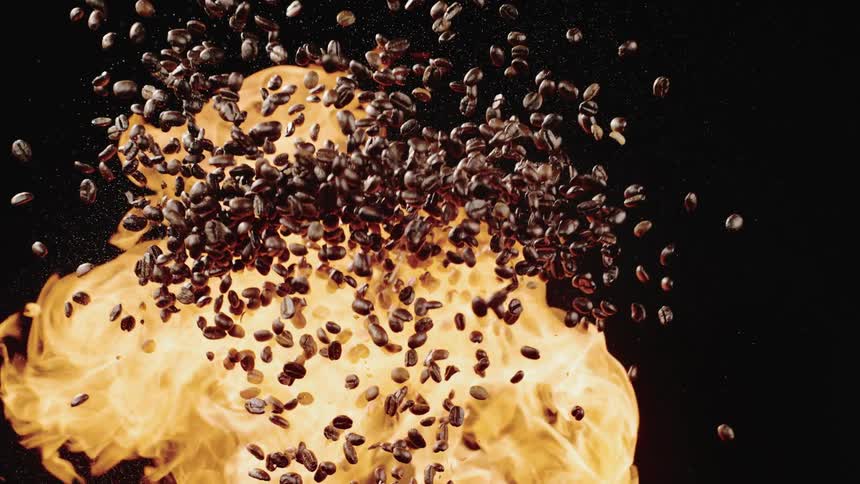 Coffee beans and flame expand in the air