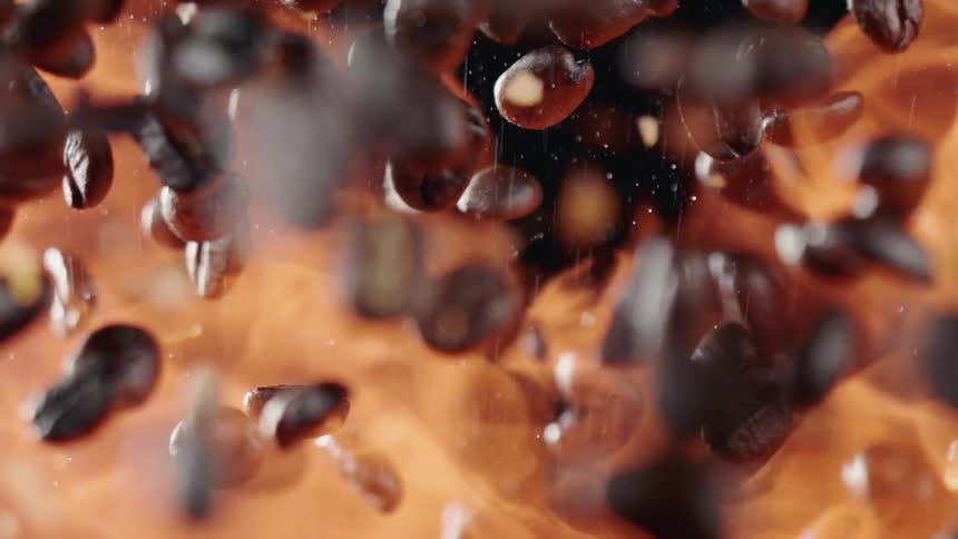 The fire surrounds the thrown coffee beans