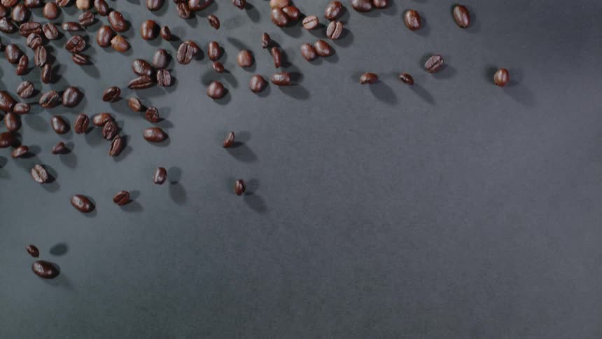 Coffee beans are skittering across a surface
