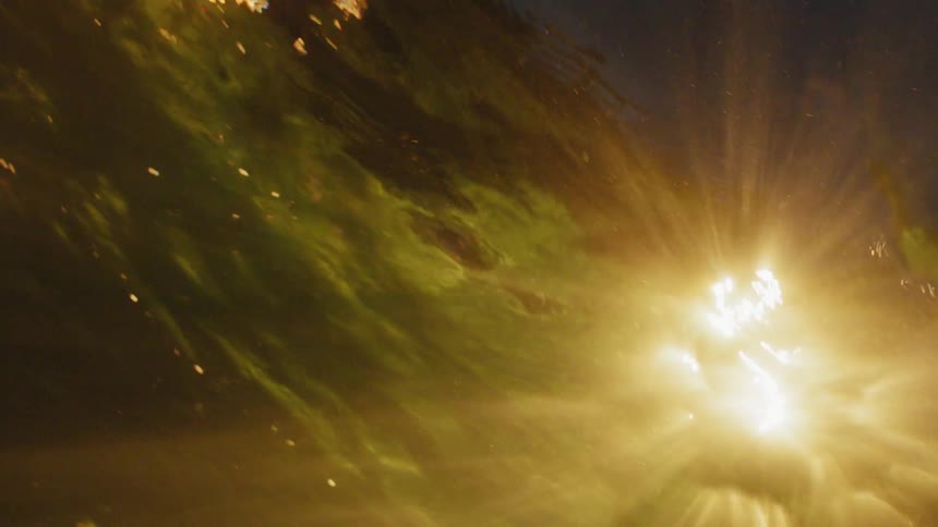 Light streams through water