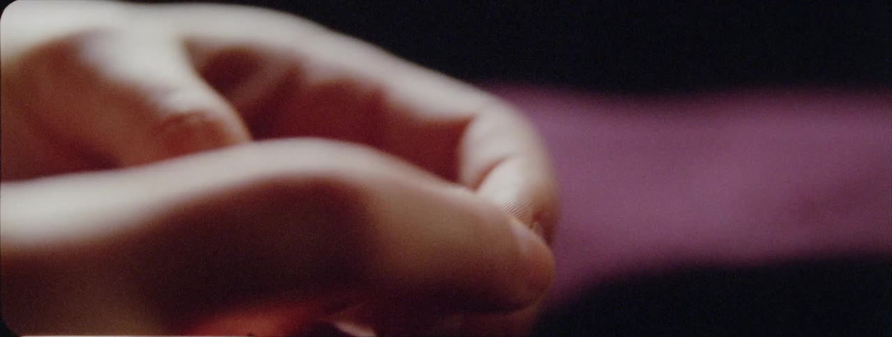 Two hands hold a locket