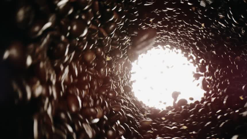 Coffee beans are spinning inside machine