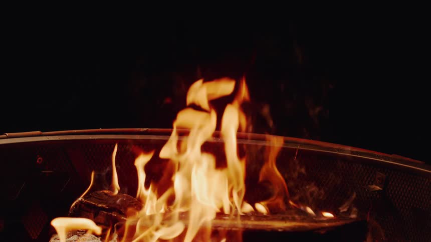 Flames engulfing wood in fire